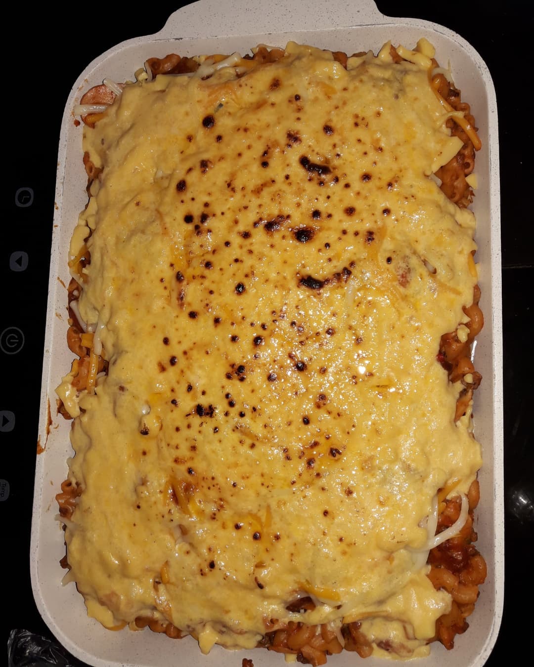 Lasagna - Traditional Italian pasta dish with layers of meat, cheese, and sauce at CJP Food and Delicacies